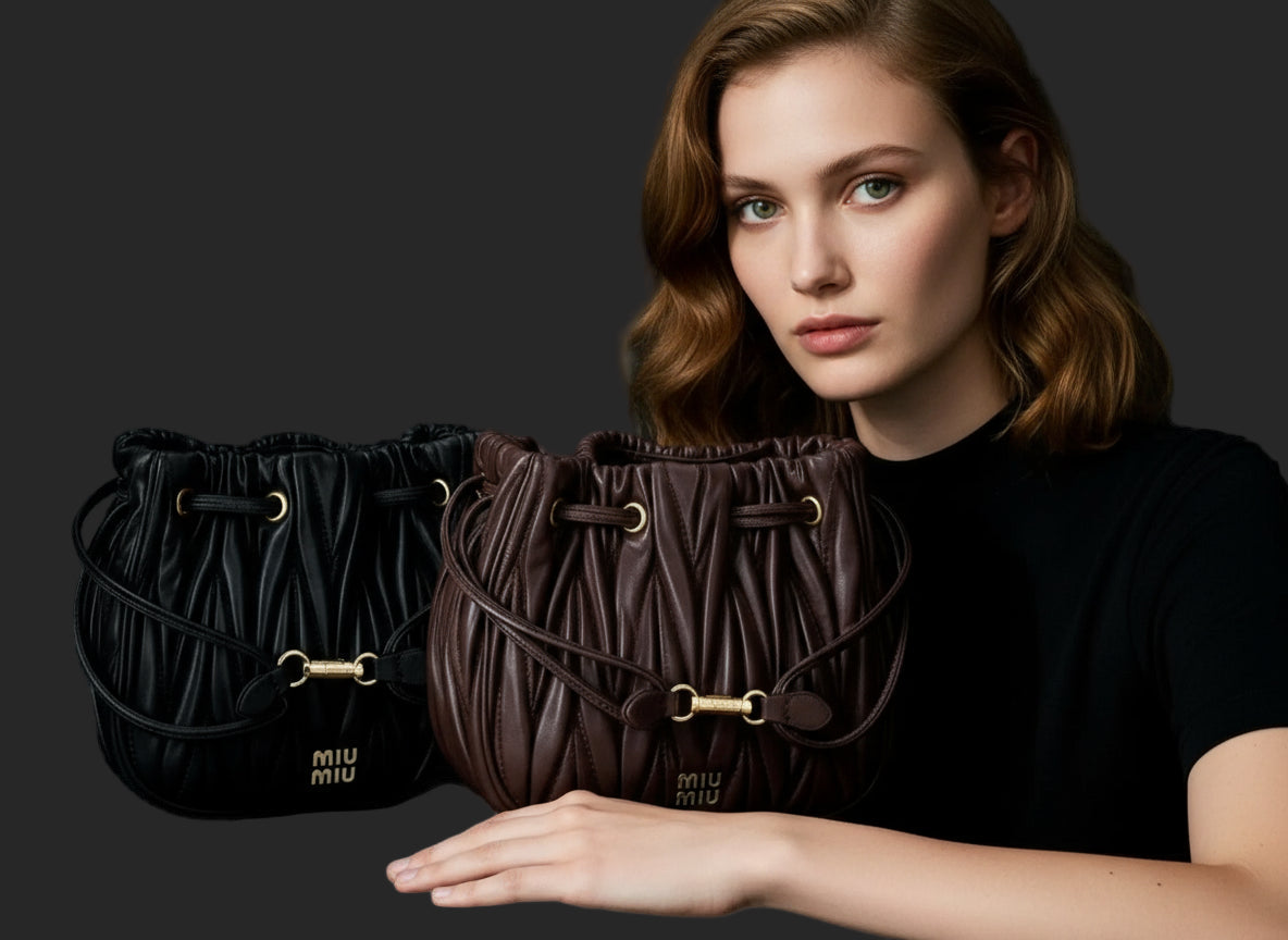 Black leather drawstring bucket bag with gold hardware and ’miu miu’ branding.