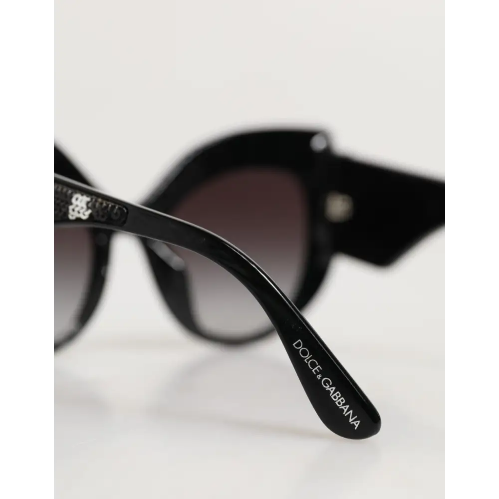 Dolce & Gabbana Sonnenbrille mit Schmetterlingsrahmen Schwarz und Silber mit Pailletten