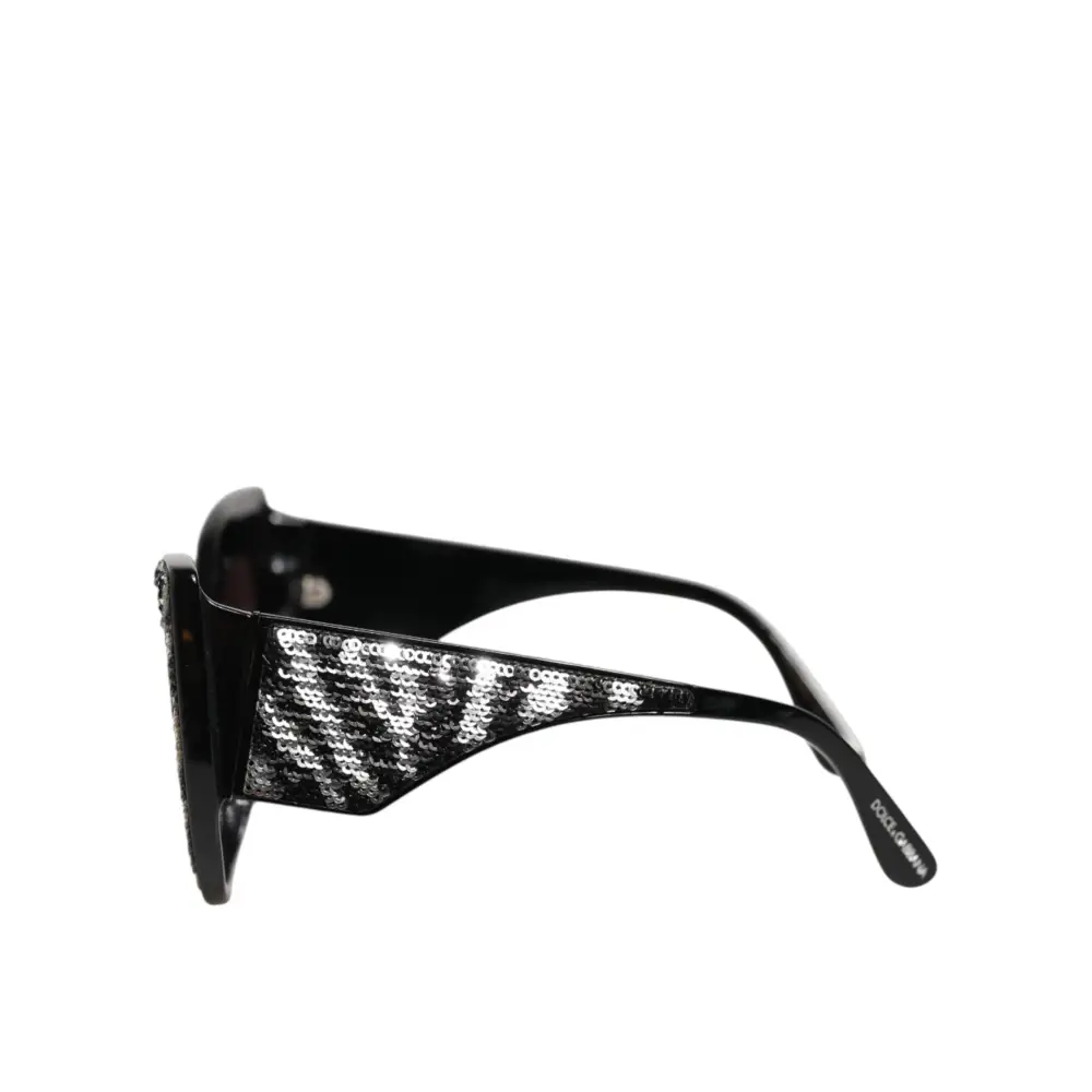 Dolce & Gabbana Sonnenbrille mit Schmetterlingsrahmen Schwarz und Silber mit Pailletten