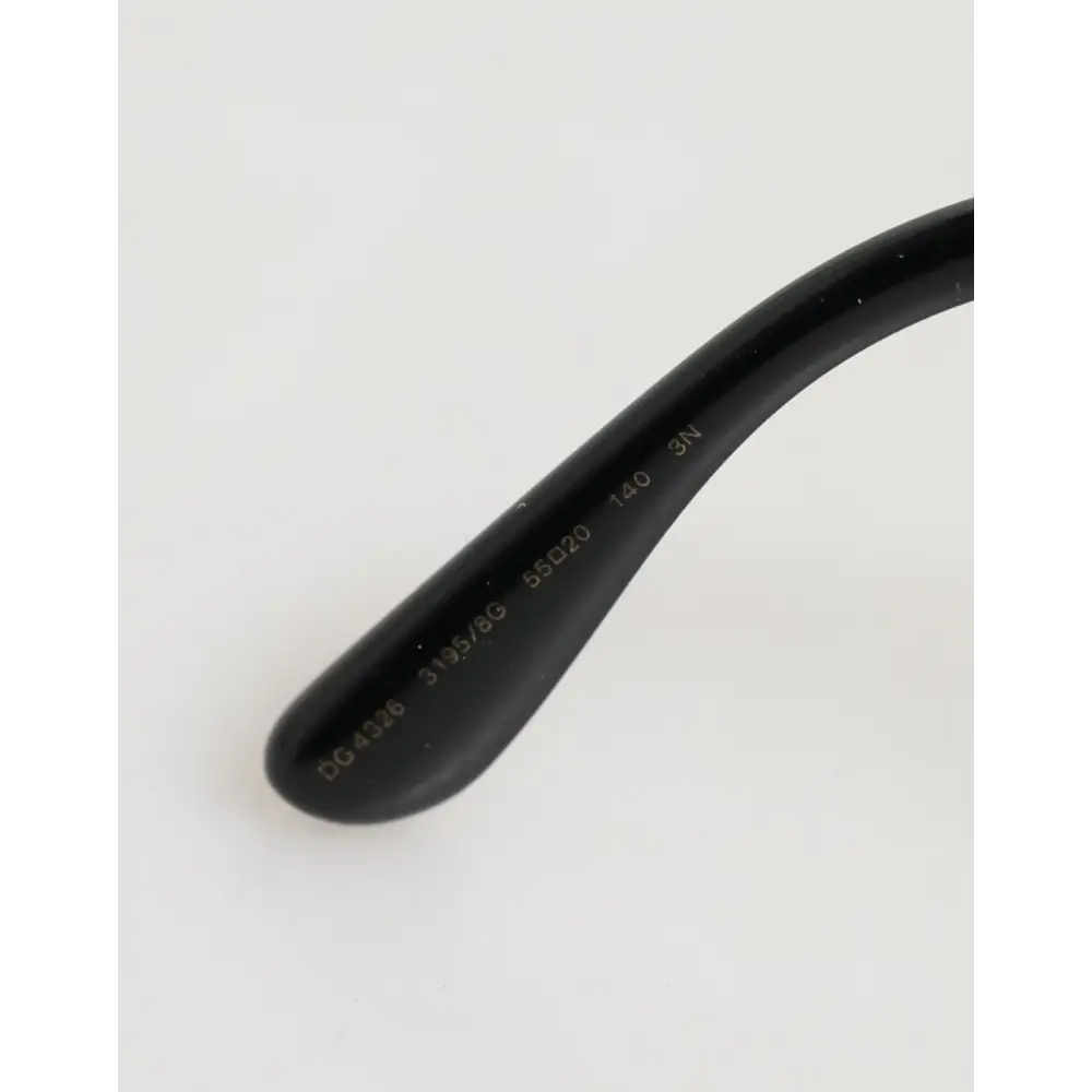 Dolce & Gabbana Sonnenbrille mit Schmetterlingsrahmen Schwarz und Silber mit Pailletten