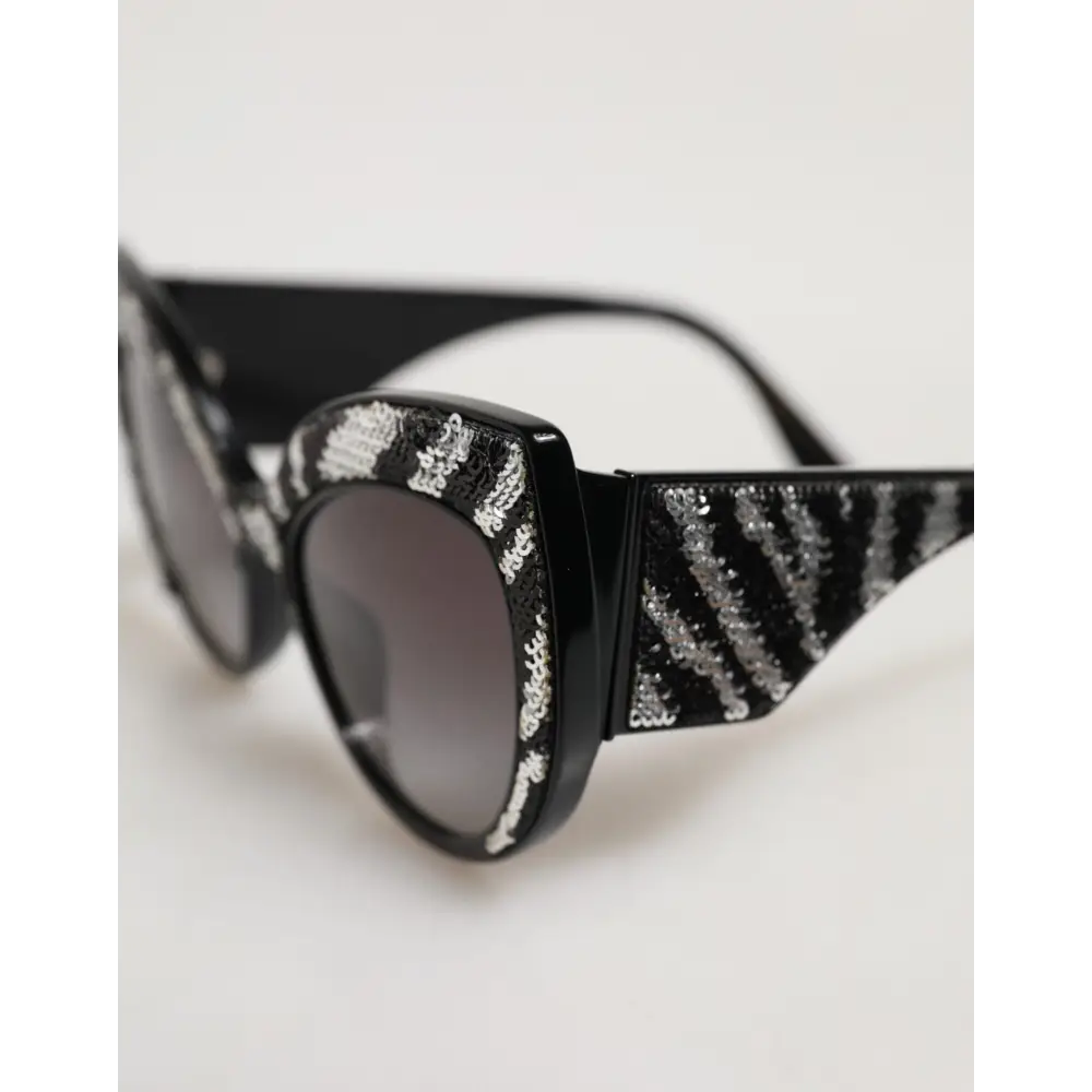 Dolce & Gabbana Sonnenbrille mit Schmetterlingsrahmen Schwarz und Silber mit Pailletten