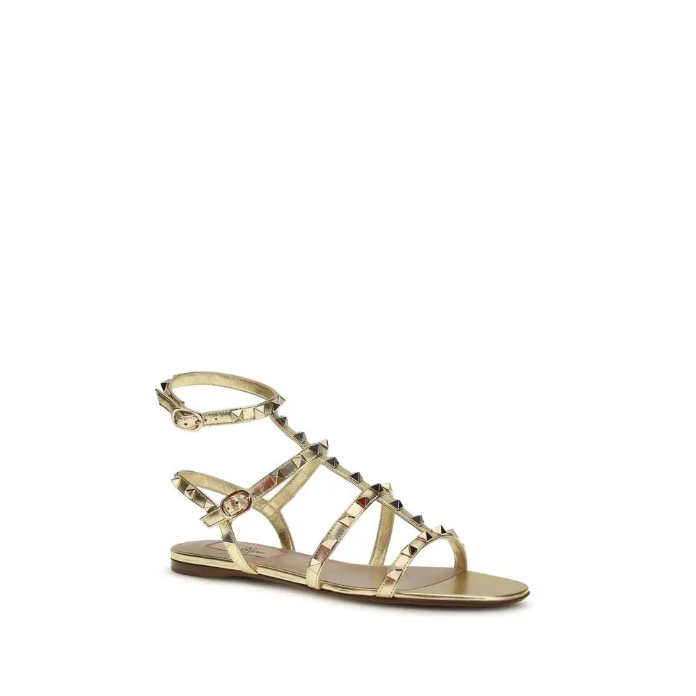 Valentino Garavani Flache Sandalen aus Kalbsleder Bos Taurus in Gold